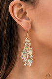 Interstellar Illumination - Multi - Paparazzi Accessories -  Item #P5ST-MTXX-048XX Golden ribbons of glassy white rhinestones whirl around a chandelier of classic round white rhinestones and emerald and square cut iridescent rhinestones, coalescing into an effervescent elegance. Earring attaches to a standard fishhook fitting.  Sold as one pair of earrings.