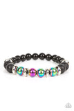 Mega Metamorphic - Multi - Paparazzi Accessories -  Item #P9SE-URMT-229XX Infused with a section of polished black beads, a stellar assortment of oil spill beads, silver accents, and black lava rock beads are threaded along stretchy bands around the wrist for an urban flair.  Sold as one individual bracelet.