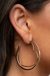 Love Goes Around - Gold - Paparazzi Accessories -  Item #P5HO-GDXX-233XX A gold wire heart is encircled in an oversized gold hoop, resulting in a heart-stopping shimmer. Earring attaches to a standard post fitting. Hoop measures approximately 2" in diameter.  Sold as one pair of hoop earrings.