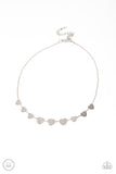 Dainty Desire - Silver - Paparazzi Accessories -  Item #P2CH-SVXX-078XX Delicately scratched in shimmer, a dainty collection of flat silver heart frames gradually increases in size along a shiny silver snake chain around the neck for a flirtatious fashion. Features an adjustable clasp closure.  Sold as one individual choker necklace. Includes one pair of matching earrings.