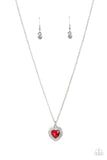 Taken with Twinkle - Red - Paparazzi Accessories -  Item #P2RE-RDXX-237XX Bordered in stacked rows of glassy white rhinestones, a fiery red heart shaped gem sparkles at the center of a dainty silver chain for a flirtatious fashion. Features an adjustable clasp closure.  Sold as one individual necklace. Includes one pair of matching earrings.