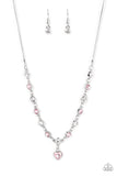 True Love Trinket - Pink - Paparazzi Accessories -  Item #P2WH-PKXX-453FF A pink rhinestone heart charm dances from a strand of white and pink rhinestones, resulting in a flirtatious sparkle below the collar. Features an adjustable clasp closure.  Sold as one individual necklace. Includes one pair of matching earrings.