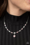 True Love Trinket - Pink - Paparazzi Accessories -  Item #P2WH-PKXX-453FF A pink rhinestone heart charm dances from a strand of white and pink rhinestones, resulting in a flirtatious sparkle below the collar. Features an adjustable clasp closure.  Sold as one individual necklace. Includes one pair of matching earrings.