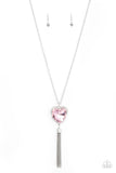 Finding My Forever - Pink - Paparazzi Accessories -  Item #P2WH-PKXX-418XX Bordered in a ribbon of glassy white rhinestones, an oversized pink heart-shaped gem seemingly floats at the bottom of an extended silver chain. A shimmery silver chain tassel dances from the bottom of the sparkly pendant for a flirtatious finish. Features an adjustable clasp closure.  Sold as one individual necklace. Includes one pair of matching earrings.