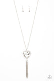 Finding My Forever - White - Paparazzi Accessories -  Item #P2WH-WTXX-295XX Bordered in a ribbon of glassy white rhinestones, an oversized white heart-shaped gem seemingly floats at the bottom of an extended silver chain. A shimmery silver chain tassel dances from the bottom of the sparkly pendant for a flirtatious finish. Features an adjustable clasp closure.  Sold as one individual necklace. Includes one pair of matching earrings.