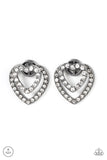 Ever Enamored - Black - Paparazzi Accessories -  Item #P5PO-BKXX-203XX A dainty gunmetal heart dotted in glassy white rhinestones flirtatiously attaches to a double-sided post, while a slightly larger white rhinestone encrusted gunmetal heart peeks out beneath the ear for a romantic finish. Earring attaches to a standard post fitting.  Sold as one pair of double-sided post earrings.