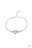 Cupids Confessions - Red - Paparazzi Accessories -  Item #P9RE-RDXX-150XX Two shiny silver hearts flank a red rhinestone dotted heart at the center of two curved silver bars, linking into a flirtatious centerpiece around the wrist. Features an adjustable clasp closure.  Sold as one individual bracelet.