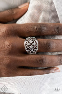 WISTFUL Thinking - Silver - Paparazzi Accessories -  Item #P4WH-SVXX-196GJ A wide, high sheen silver frame, infused with fanciful floral filigree, creates a romantically idyllic centerpiece atop the finger. Features a stretchy band for a flexible fit.  Sold as one individual ring.