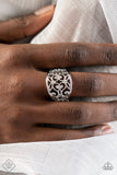 WISTFUL Thinking - Silver - Paparazzi Accessories -  Item #P4WH-SVXX-196GJ A wide, high sheen silver frame, infused with fanciful floral filigree, creates a romantically idyllic centerpiece atop the finger. Features a stretchy band for a flexible fit.  Sold as one individual ring.