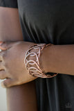 Circa de Contender - Copper - Paparazzi Accessories -  Etched and hammered in linear and diamond-cut shimmer, glistening copper circles join into a dramatic cuff around the wrist.  Sold as one individual bracelet.