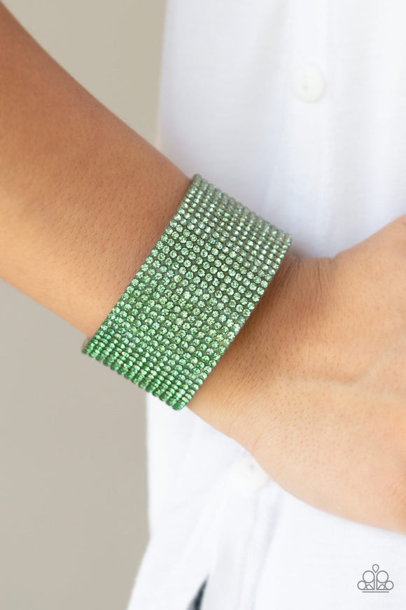 Fade Out - Green - Paparazzi Accessories -  Row after row of glassy rhinestones gradually fade from light green to dark green across the front of a thick gray suede band for a trendy ombre look. Features an adjustable snap closure.  Sold as one individual bracelet.