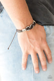 Off-Road Tourist - Brown - Paparazzi Accessories  Infused with white twine cording, antiqued silver rings are threaded along strands of brown leather bands for a rustic look. Features an adjustable sliding knot closure.  Sold as one individual bracelet.