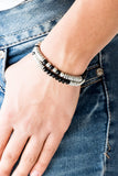 Downright Dressy - Black - Paparazzi Accessories  Classic silver beads, faceted black crystal-like beads, and dainty silver discs are threaded along stretchy bands, creating shimmery layers across the wrist.  Sold as one set of two bracelets.