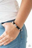 Very VIP -Black - Paparazzi Accessories  A collection of polished black, classic silver, and crystal-like hematite beads are threaded along a stretchy band, creating a refined look around the wrist.  Sold as one individual bracelet.   Get The Complete Look! Necklace: "The Big-Leaguer - Black" (Sold Separately while supplies last) SN0203