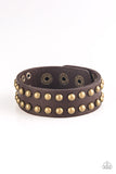 Biker Bold - Brown - Paparazzi Accessories  Rows of burnished brass studs are encrusted along the front of a brown leather band for a rugged look. Features an adjustable snap closure.  Sold as one individual bracelet.  P9UR-BNXX-391XX