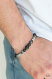 Strength - Black - Paparazzi Accessories Infused with dainty silver accents, a collection of faceted cube beads, refreshing stone beads, and earthy lava rock beads are threaded along a stretchy band around the wrist for a seasonal look.  Sold as one individual bracelet.  P9SE-URBK-375XX