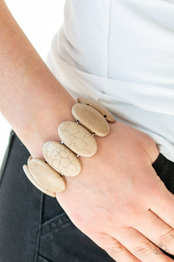 Dramatically Nomadic - Brown - Paparazzi Accessories  Chiseled into smooth ovals, earthy brown stones are threaded along stretchy elastic bands around the wrist for an artisan inspired look.  Sold as one individual bracelet.