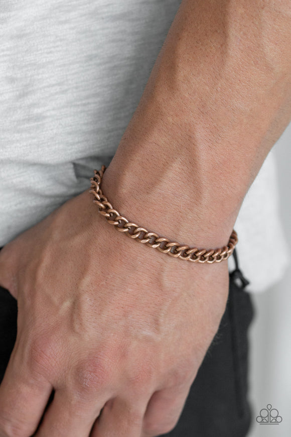 Goal! - Copper - Paparazzi Accessories  Shiny black cording knots around the ends of a copper beveled cable chain that is wrapped across the top of the wrist for a versatile look. Features an adjustable sliding knot closure.  Sold as one individual bracelet.  P9MN-URCP-001XX