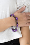 Hold My Drink - Purple - Paparazzi Accessories  Pearly and polished purple beading joins faceted gunmetal beads along a bold gunmetal chain, creating a sassy fringe around the wrist. Features an adjustable clasp closure.  Sold as one individual bracelet.   Get The Complete Look! Necklace: "Watch Me Now - Purple" (Sold Separately)