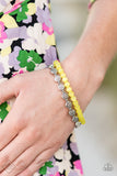 Glimpses of Malibu - Dewy Dandelions - Yellow - Bracelet  One strand of silver floral beads and one strand of dewy yellow cat’s eye beads are threaded along stretchy bands, creating whimsical layers around the wrist.  Sold as one set of two bracelets.  Get the matching Ring: (While supplies last) Crazy About Daisies - silver  Aug 2020