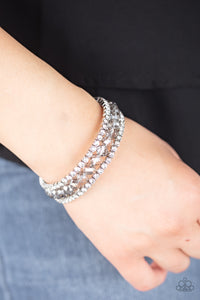 Glam-ified Fashion - Silver A refined collection of white rhinestone encrusted frames and smoky crystal-like beads are threaded along a coiled wire, creating a timeless infinity wrap style bracelet around the wrist.  Sold as one individual bracelet.