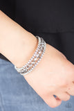 Glam-ified Fashion - Silver A refined collection of white rhinestone encrusted frames and smoky crystal-like beads are threaded along a coiled wire, creating a timeless infinity wrap style bracelet around the wrist.  Sold as one individual bracelet.