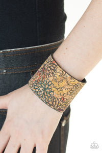 Cork Culture - Multi Painted in a colorfully distressed floral pattern, a thick cork-like leather band wraps around the wrist for a statement-making look. Features an adjustable snap closure.  Sold as one individual bracelet.