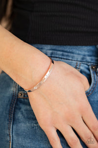 PAPARAZZI - Dainty Dazzle - Rose Gold Glassy white rhinestones are sprinkled across the front of a dainty rose gold cuff for a refined look.  Sold as one individual bracelet.