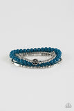 Blooming Buttercups - Blue - Paparazzi Accessories - Mismatched silver beads and strands of glassy blue beads are threaded along stretchy bands. Infused with silver accents, dainty rose blossoms adorn the wrist for a seasonal finish.  Sold as one set of four bracelets.