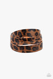 Hey GRRirl - Brown - Paparazzi Accessories - Painted in a lifelike brown and black cheetah print, thick leather bands have been spliced into layers that wave across the wrist for a wild look. Features an adjustable snap closure.  Sold as one individual bracelet.