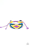 Beautifully Badlands - Purple - Paparazzi Accessories - Threaded along invisible thread, a dainty collection of purple, blue, black, white, and yellow seed beads weave into a colorful textile pattern across the wrist for a tribal inspired look. Features an adjustable sliding knot closure.  Sold as one individual bracelet.