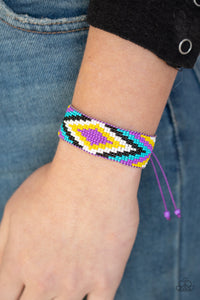 Beautifully Badlands - Purple - Paparazzi Accessories - Threaded along invisible thread, a dainty collection of purple, blue, black, white, and yellow seed beads weave into a colorful textile pattern across the wrist for a tribal inspired look. Features an adjustable sliding knot closure.  Sold as one individual bracelet.