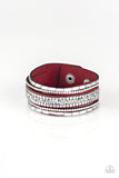 Rebel In Rhinestones - Red - Paparazzi Accessories - Item #P9DI-URRD-037XX Featuring round and emerald style cuts, glassy white rhinestones join flat silver cubes and metallic prism rhinestones along a red suede band for a sassy look. Features an adjustable snap closure.  Sold as one individual bracelet.