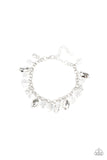 Dazing Dazzle - White - Paparazzi Accessories - Item #P9RE-WTXX-314PJ A glittery collection of sparkling white rhinestones, faceted silver beads, and glassy crystal-like beads dangle from the wrist, creating a refined fringe. Features an adjustable clasp closure.  Sold as one individual bracelet.  Get The Complete Look! Necklace: "Downstage Dazzle - White" (SN0253)