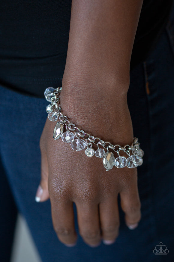 Dazing Dazzle - White - Paparazzi Accessories - Item #P9RE-WTXX-314PJ A glittery collection of sparkling white rhinestones, faceted silver beads, and glassy crystal-like beads dangle from the wrist, creating a refined fringe. Features an adjustable clasp closure.  Sold as one individual bracelet.  Get The Complete Look! Necklace: 