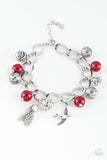 Lady Love Dove - Red - Paparazzi Accessories -  Item #P9WH-RDXX-113XX Red pearls, ornate silver beads, and white rhinestone encrusted accents swing from a dramatic silver chain. A shimmery silver bird charm and silver tassel are added to the display, creating a whimsical fringe around the wrist. Features an adjustable clasp closure.  Sold as one individual bracelet.