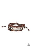 Let Faith Be Your Guide - Brown - Paparazzi Accessories - Item #P9UR-BNXX-504XX A strand of wooden beads and a braided band of brown suede flank a piece of beaded leather that features the silver frame stamped in the word, "faith," creating earthy layers around the wrist. Features an adjustable sliding knot closure.  Sold as one individual bracelet.