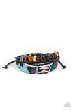 Urban Badlands - Multi - Paparazzi Accessories - Item #P9UR-MTXX-196XX A mismatched collection of wooden beads, dainty leather bands, and a decorative strand featuring a colorful textile pattern layer across the wrist for a rustic flair. Features an adjustable sliding knot closure.  Sold as one individual at DeesBlings.com - Affordable Fashion Jewelry that is Lead and Nickel free.