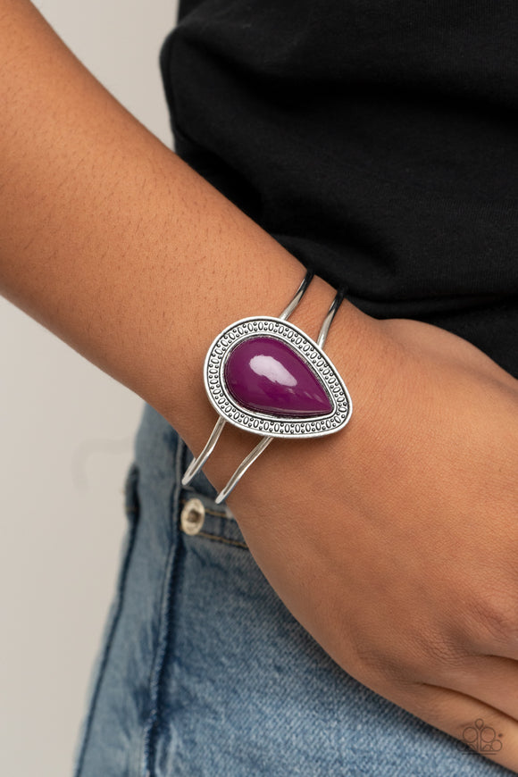 Over The Top Pop - Purple - Paparazzi Accessories  Item #P9WH-PRXX-229XX A shiny Magenta Purple teardrop bead is pressed into the center of a studded silver frame atop an airy silver cuff, creating a vibrant pop of color around the wrist. Features a hinged closure.  Sold as one individual bracelet.