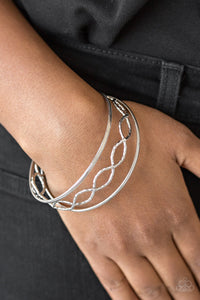 Metal Manic - Silver - Paparazzi Accessories -  Item #P9BA-SVXX-020XX Featuring serrated textures, mismatched silver bangles stack across the wrist for a casual look.  Sold as one set of three bracelets.