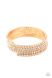 The GLOW-Digger - Gold - Paparazzi Accessories -   Item #P9RE-GDXX-285XX Encased in glistening gold fittings, row after row of glassy white rhinestones coil around the wrist, creating a blinding infinity wrap bracelet.  Sold as one individual bracelet.