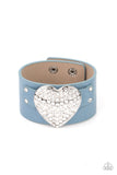 Flauntable Flirt - Blue - Paparazzi Accessories -   Encrusted in blinding white rhinestones, an oversized silver heart frame is studded in place across the front of a blue leather band, creating a flirtatious centerpiece around the wrist. Features an adjustable snap closure.  Sold as one individual bracelet.