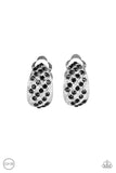 Sparkling Shells - Clip-On- Black - Paparazzi Accessories -  #P5CO-BKXX-048XX  Rows of glittery black rhinestones slant across rows of a shimmery silver frame for a refined look. Earring attaches to a standard clip-on fitting.  Sold as one pair of clip-on earrings by DeesBlings.com - Affordable Fashion Jewelry that is Lead and Nickel free.