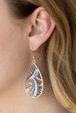 Underestimated - Silver - Paparazzi Accessories -  #P5SE-SVXX-088XX  A collection of smooth, textured, and smoky rhinestone encrusted frames collide inside an airy silver teardrop for an unexpected shimmer. Earring attaches to a standard fishhook fitting.  Sold as one pair of earrings by DeesBlings.com - Affordable Fashion Jewelry that is Lead and Nickel free.