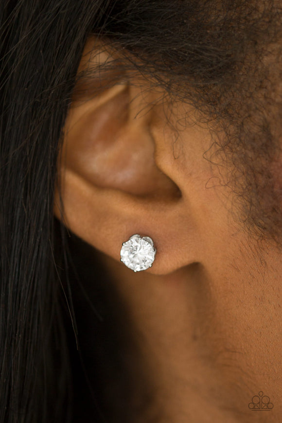 Just In TIMELESS - White - Paparazzi Accessories -  P5PO-WTXX-076XX  A sparkling white rhinestone is nestled inside a classic silver frame for a timeless look. Earring attaches to a standard post fitting.  Sold as one pair of post earrings by DeesBlings.com - Affordable Fashion Jewelry that is Lead and Nickel free.