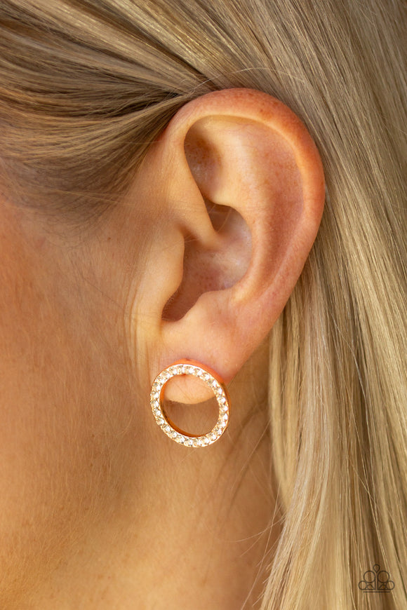 5th Ave Angel - Rose Gold - Paparazzi Accessories  P5PO-GDRS-069XX  A dainty rose gold hoop is encrusted in glassy white rhinestones for a timeless look. Earring attaches to a standard post fitting.  Sold as one pair of post earrings by DeesBlings.com - Affordable Fashion Jewelry that is Lead and Nickel free.