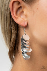 Now You SEQUIN It - Silver A cluster of bubbly silver sequins dangle from the ear, creating effortless effervescence. Earring attaches to a standard fishhook fitting.  Sold as one pair of earrings.