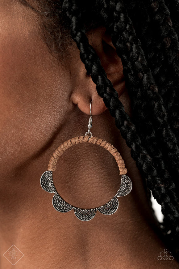 Tambourine Trend - Brown - Paparazzi Accessories - Item #P5SE-BNXX-130WB .Studded silver ruffles fan out from the bottom of an airy silver hoop that has been wrapped in brown suede as an earthy accent. Earring attaches to a standard fishhook fitting.  Sold as one pair of earrings.  September 2020 Fashion Fix