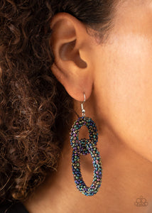 Luck BEAD a Lady - Multi - Paparazzi Accessories -  Item #P5ST-MTXX-035XX A dainty collection of iridescent oil spill seed beads adorns two interlocking hoops, creating a colorfully stacked lure. Earring attaches to a standard fishhook fitting.  Sold as one pair of earrings.