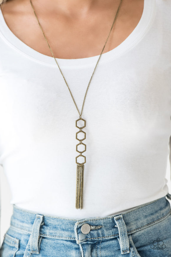 Ready, Set, GEO! - Brass - Paparazzi Accessories  Four brass hexagon frames connect at the bottom of a lengthened brass chain, creating an edgy stacked pendant. A glistening brass tassel swings from the bottom of the geometric pendant, adding movement to the modern piece. Features an adjustable clasp closure.  Sold as one individual necklace. Includes one pair of matching earrings.